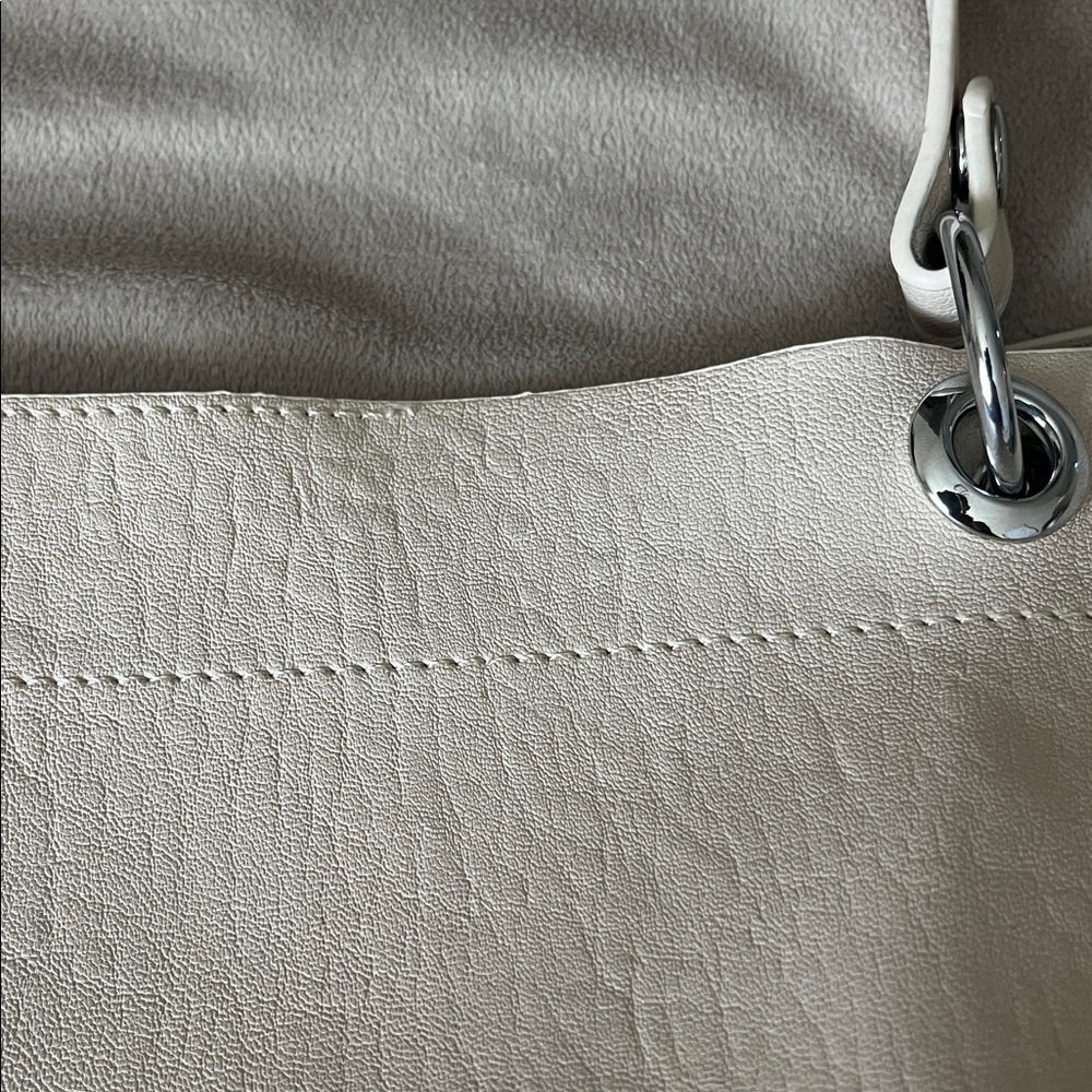 Madison West Purse in a purse
Cream purse w/ silver details. - Picture 6 of 6